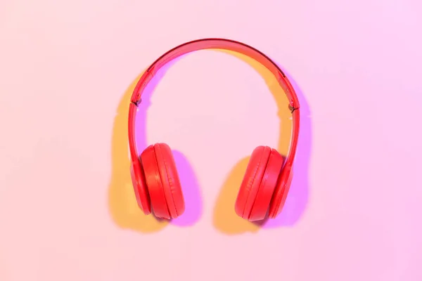 Modern headphones on color background — Stock Photo, Image