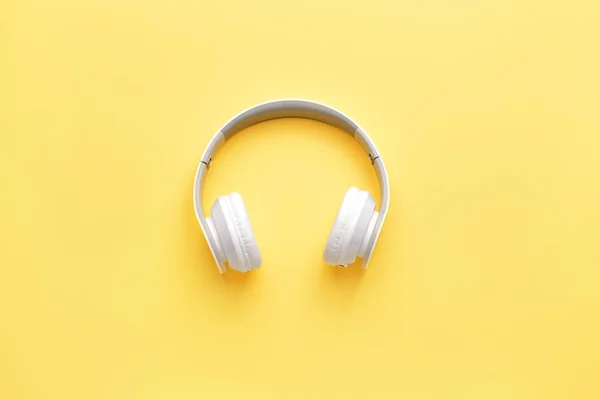 Modern headphones on color background — Stock Photo, Image