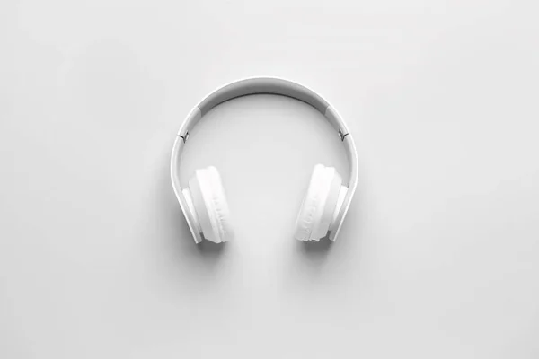 Modern headphones on light background — Stock Photo, Image