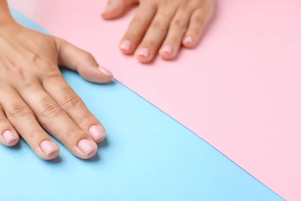 Female hands with beautiful manicure on color background — Stock Photo, Image