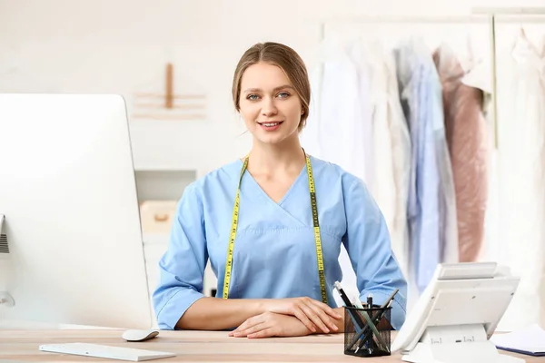 Worker of modern dry-cleaner\'s at reception