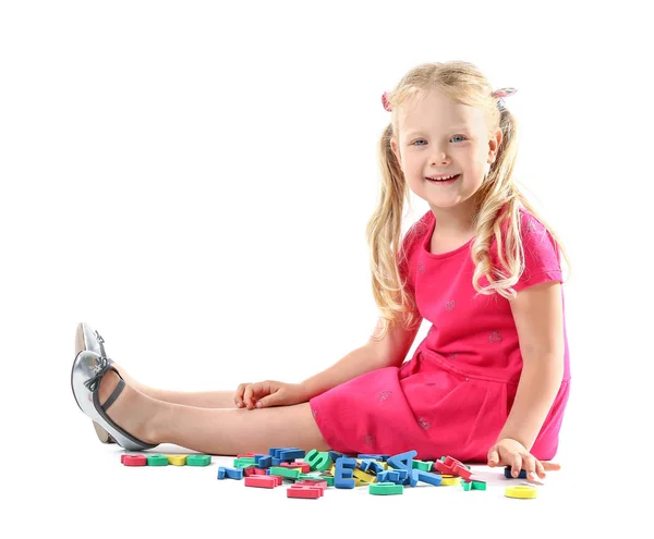 Cute little girl with letters on white background — Stock Photo, Image