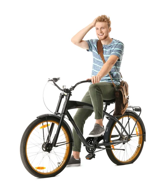 Junger Mann mit Fahrrad vor weißem Hintergrund — Stockfoto