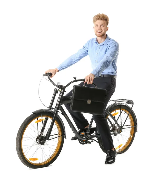 Jungunternehmer fährt Fahrrad vor weißem Hintergrund — Stockfoto