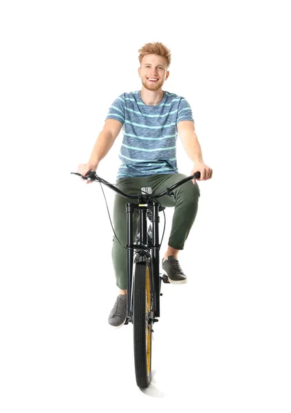 Młody człowiek jeździ rowerem na białym tle — Zdjęcie stockowe