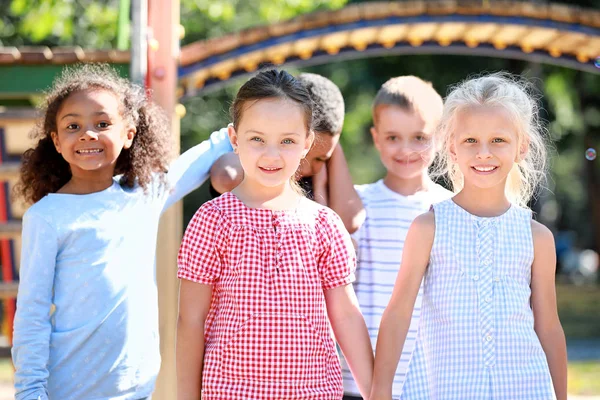 Cute little children on playground outdoors — Stock Photo, Image