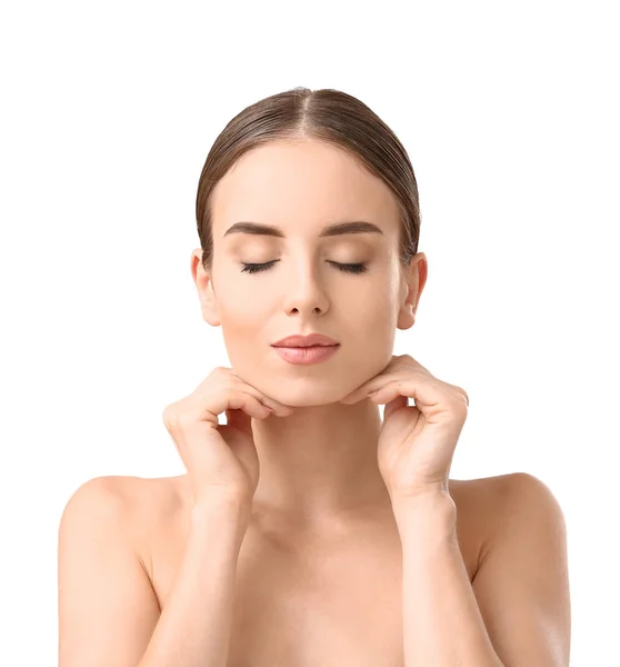 Beautiful woman massaging her face against white background — Stock Photo, Image