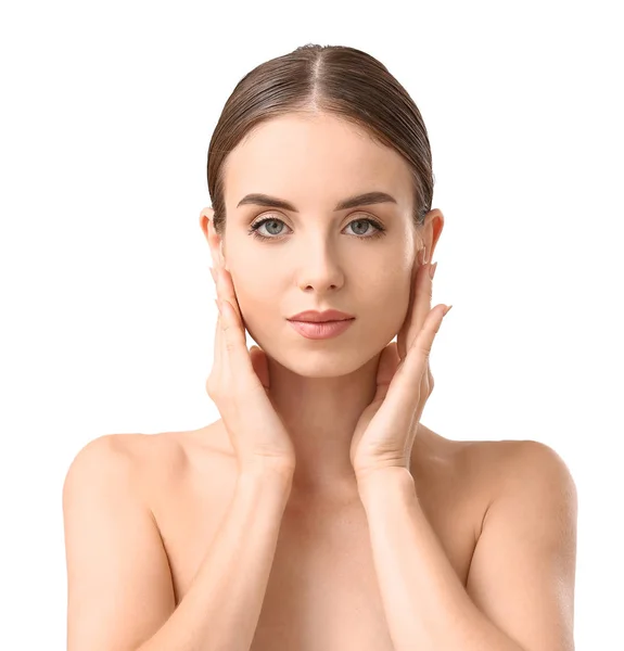 Beautiful woman massaging her face against white background — Stock Photo, Image