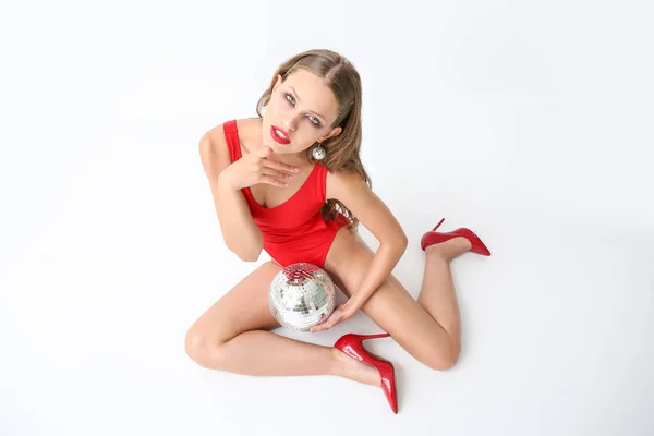 Fashionable young woman with disco ball on white background — Stock Photo, Image