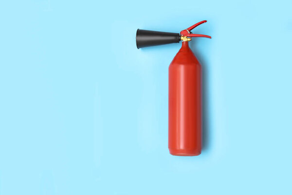 Fire extinguisher on color background