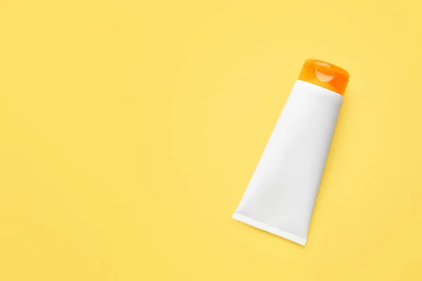 Tube of sun protection cream on color background — Stock Photo, Image
