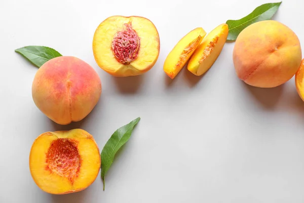 Ripe peaches on light background — Stock Photo, Image