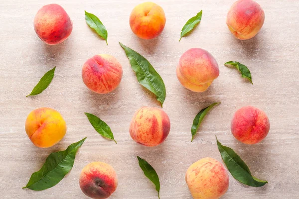 Ripe peaches on grey background — Stock Photo, Image