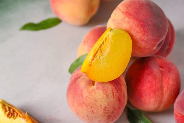 Ripe juicy peaches on table