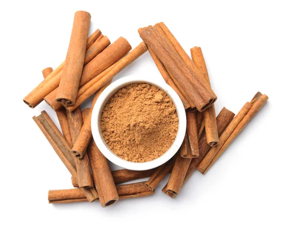 Aromatic cinnamon sticks and powder on white background — Stock Photo, Image