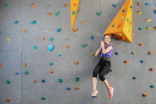 Young woman in climbing gym — Stock Photo, Image