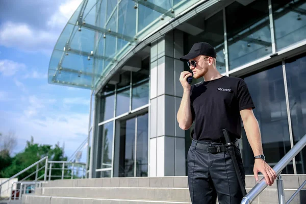 Handsome male security guard outdoors — Stock Photo, Image