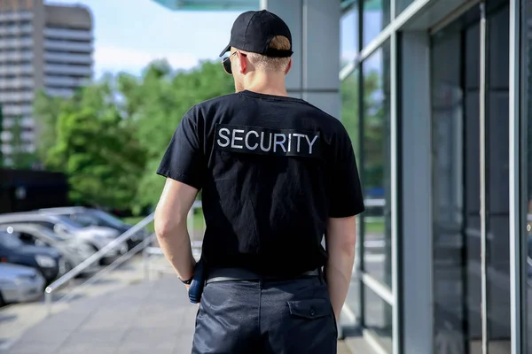 Handsome male security guard outdoors — Stock Photo, Image