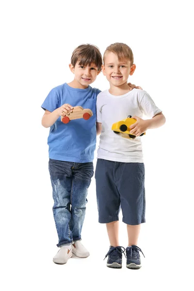 Cute little boys with toys on white background — Stock Photo, Image
