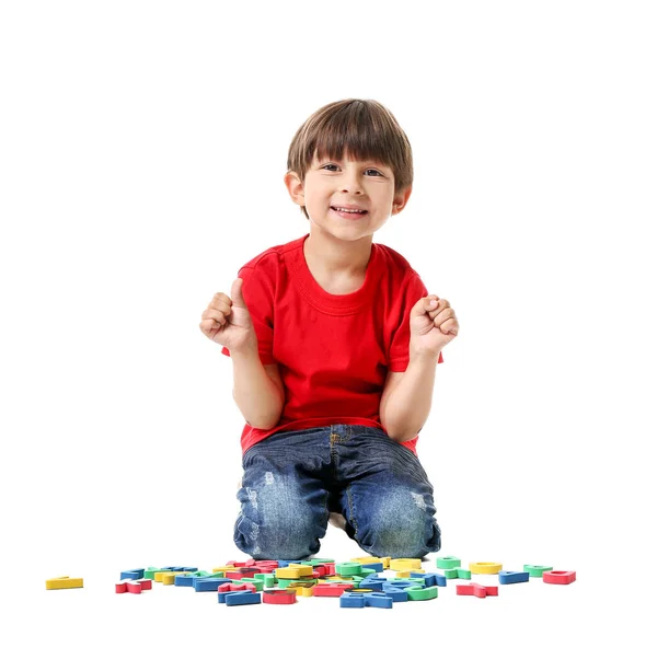 Cute little boy with letters on white background — Stock Photo, Image