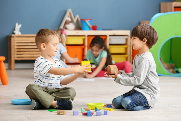 Cute little children playing in kindergarten — Stock Photo, Image