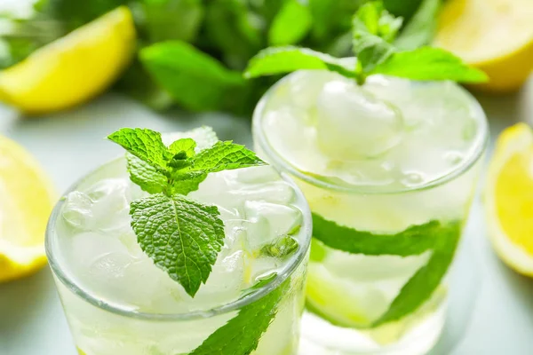 Glasses of fresh mojito on table, closeup — Stock Photo, Image