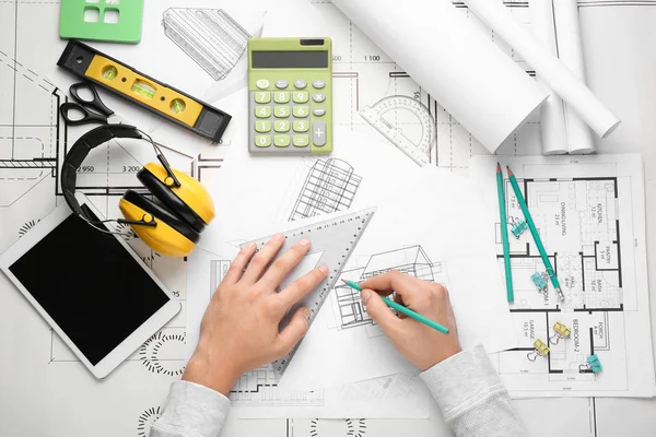 Male architect working at table, top view — Stock Photo, Image