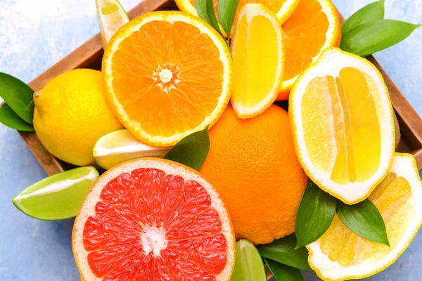 Different citrus fruits in box, closeup — Stock Photo, Image