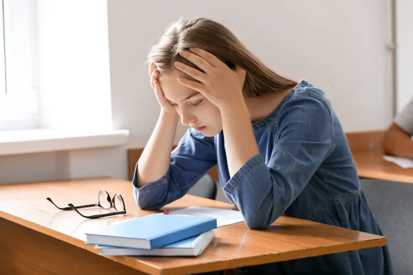 Teenage girl passing school test in classroom — Stock Photo, Image