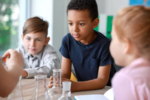 Cute little pupils at chemistry lesson in classroom — Stock Photo, Image
