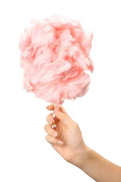 Female hand with tasty cotton candy on white background — Stock Photo, Image