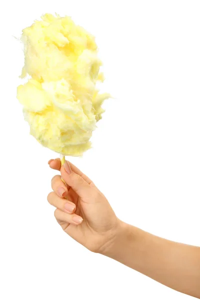 Ženská ruka s chutnými bavlněnými cukrovinky na bílém pozadí — Stock fotografie