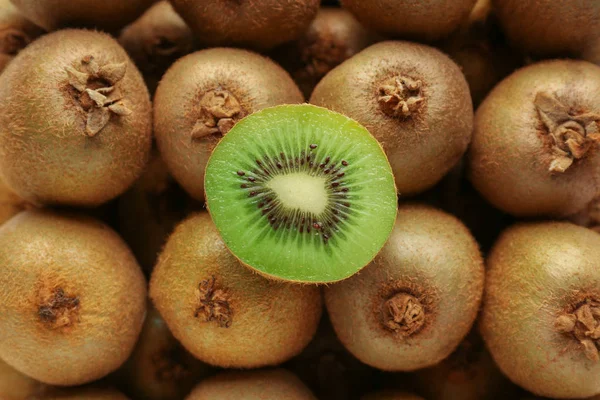 Many ripe kiwi as background — Stock Photo, Image