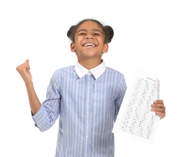 Happy African-American girl with results of school test on white background — Stock Photo, Image