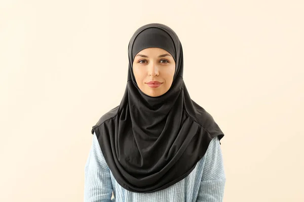 Portrait of Muslim woman on light background — Stock Photo, Image