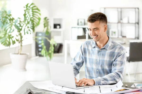 Handsome male architect working in office — Stock Photo, Image