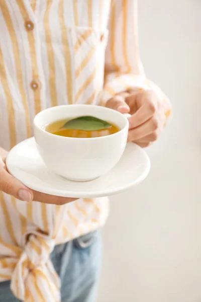 Woman holding cup of hot tea, closeup — Stock Photo, Image