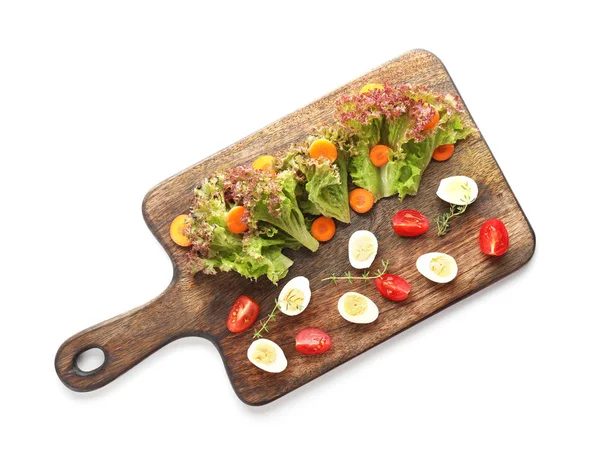Wooden board with quail eggs and vegetables on white background — Stock Photo, Image
