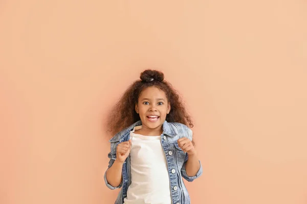 Happy African-American girl on color background — Stock Photo, Image