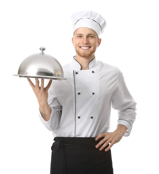 Bonito chef masculino com bandeja e cloche no fundo branco — Fotografia de Stock