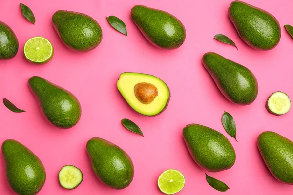 Fresh avocados, fruit and vegetables on color background — Stock Photo, Image