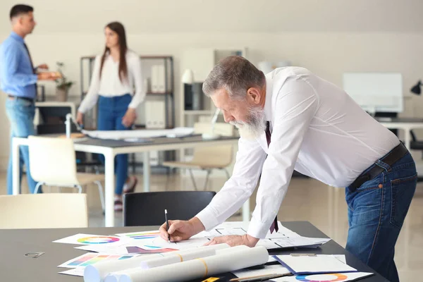 Mature male architect working in office — Stock Photo, Image