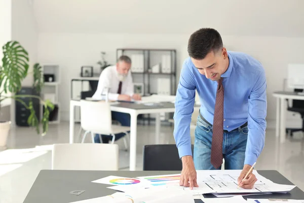 Handsome male architect working in office — Stock Photo, Image