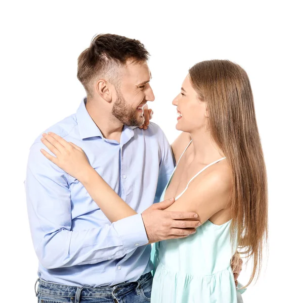 Feliz jovem casal apaixonado no fundo branco — Fotografia de Stock