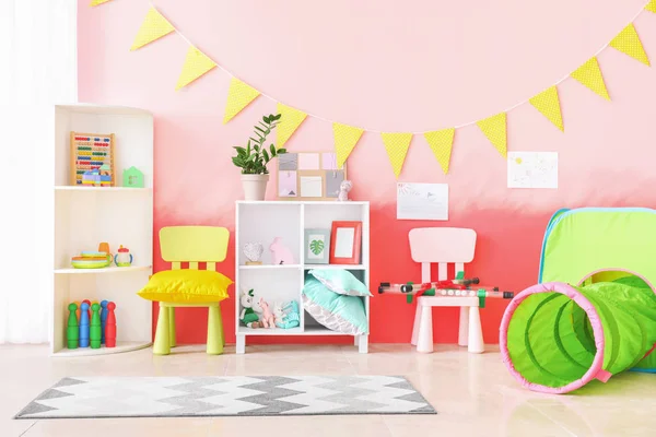 Interior of modern children\'s room with play tunnel