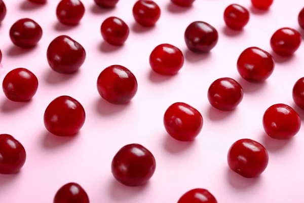 Many ripe sweet cherry on color background — Stock Photo, Image