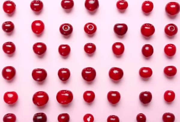 Many ripe sweet cherry on color background — Stock Photo, Image