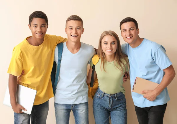 Portrait of young students on light background — Stock Photo, Image