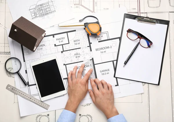 Male architect working at table, top view — Stock Photo, Image