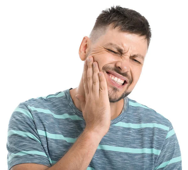 Man som lider av tandvärk mot vit bakgrund — Stockfoto